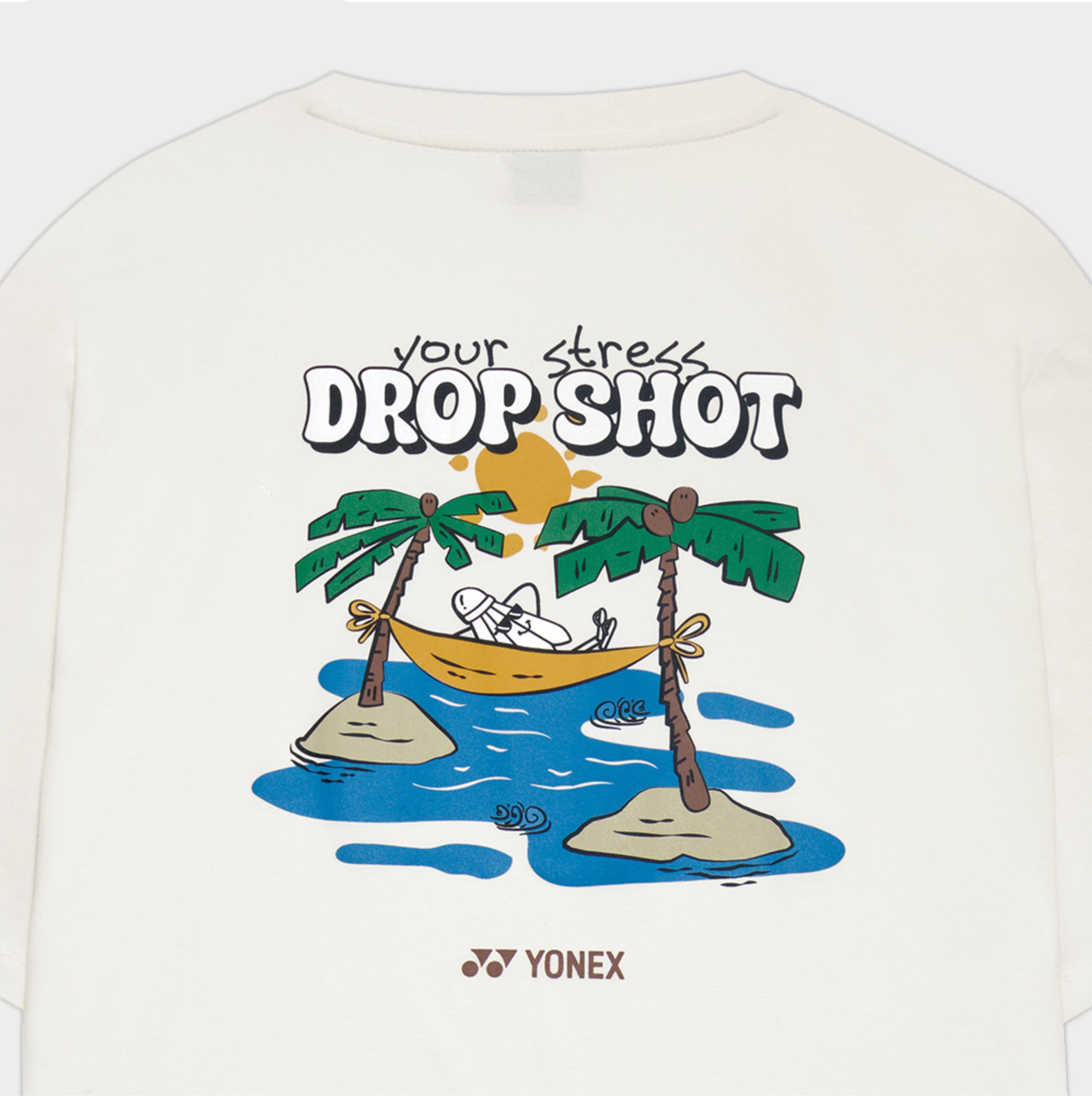 T-shirt with a cartoon design of a person in a boat between two palm trees, with 'Your Stress Drop Shot' text, on a white background. Yonex logo visible.