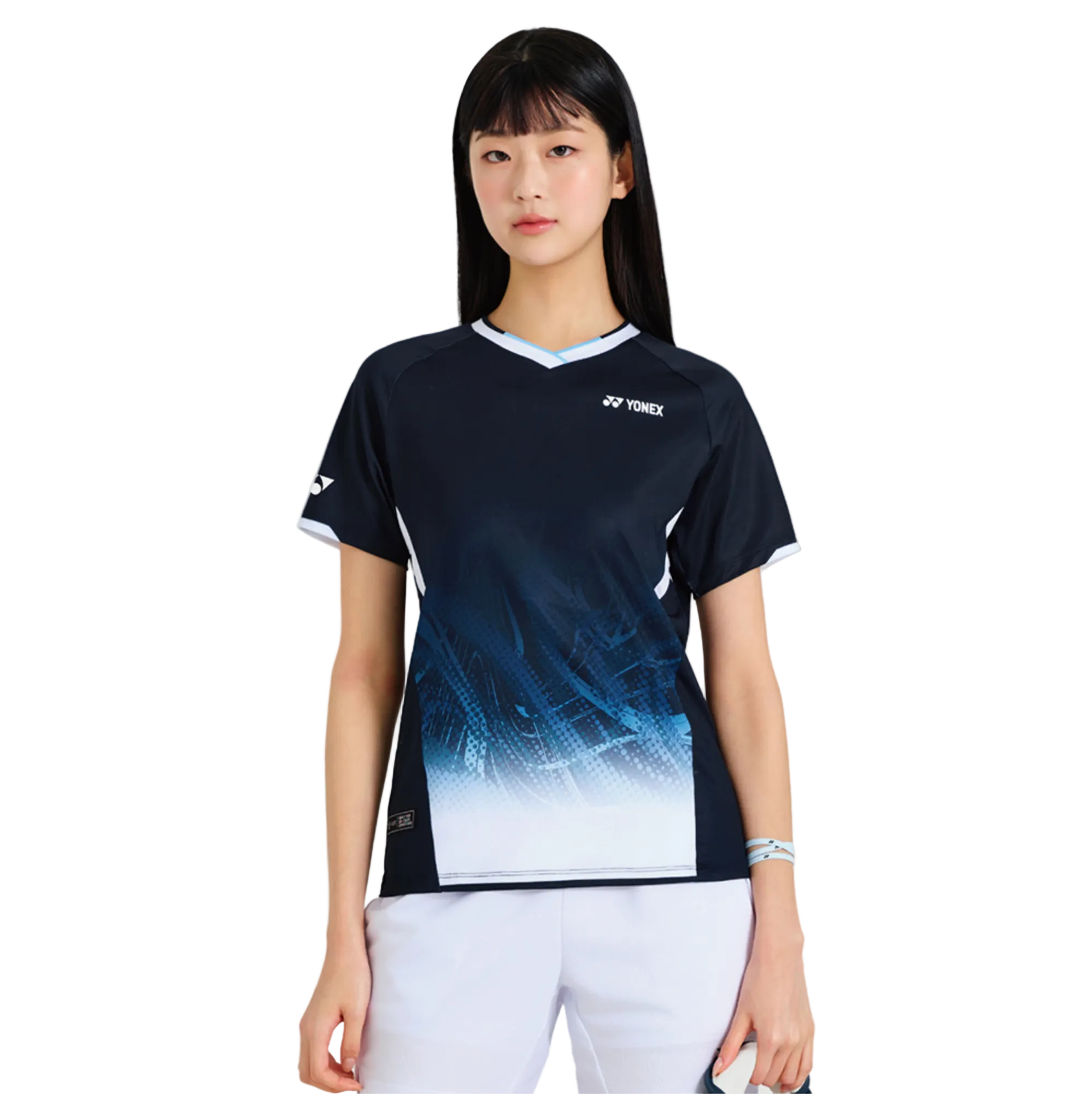 Person wearing a Yonex sports outfit on a white background