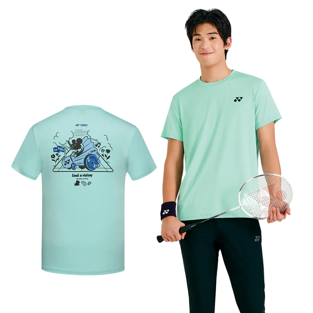 Person wearing a light blue t-shirt with Yonex logo, holding a badminton racket, on a white background.